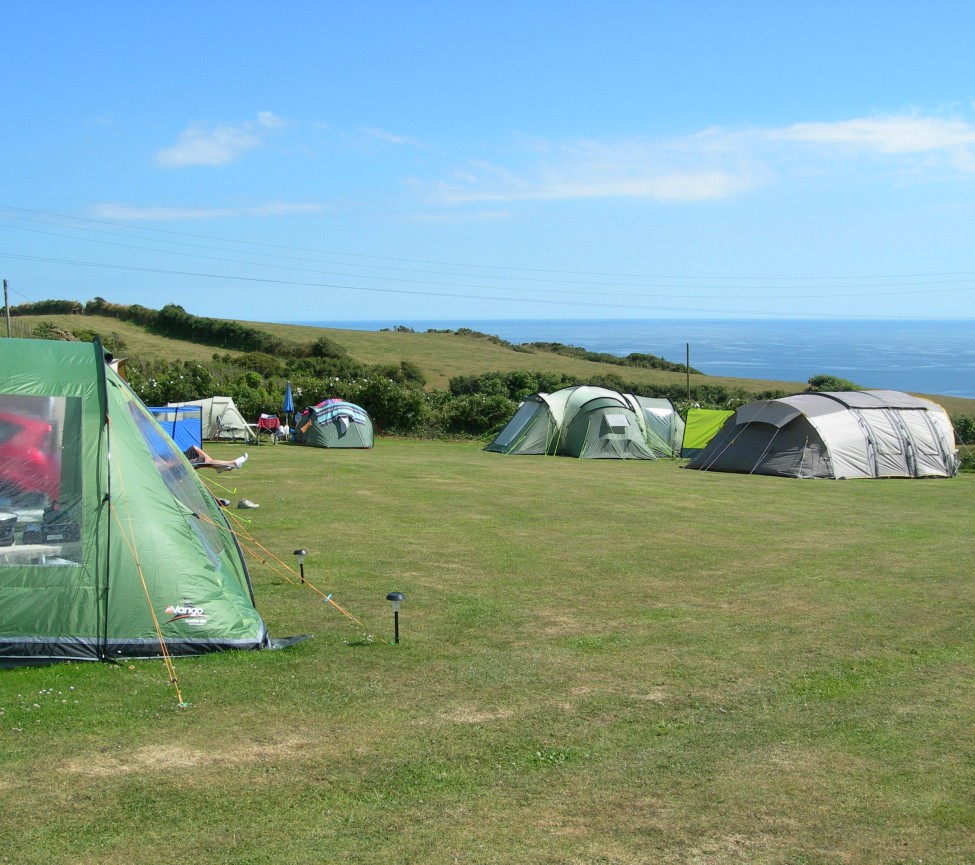camping field with sea views at Polruan Holiday Centre
