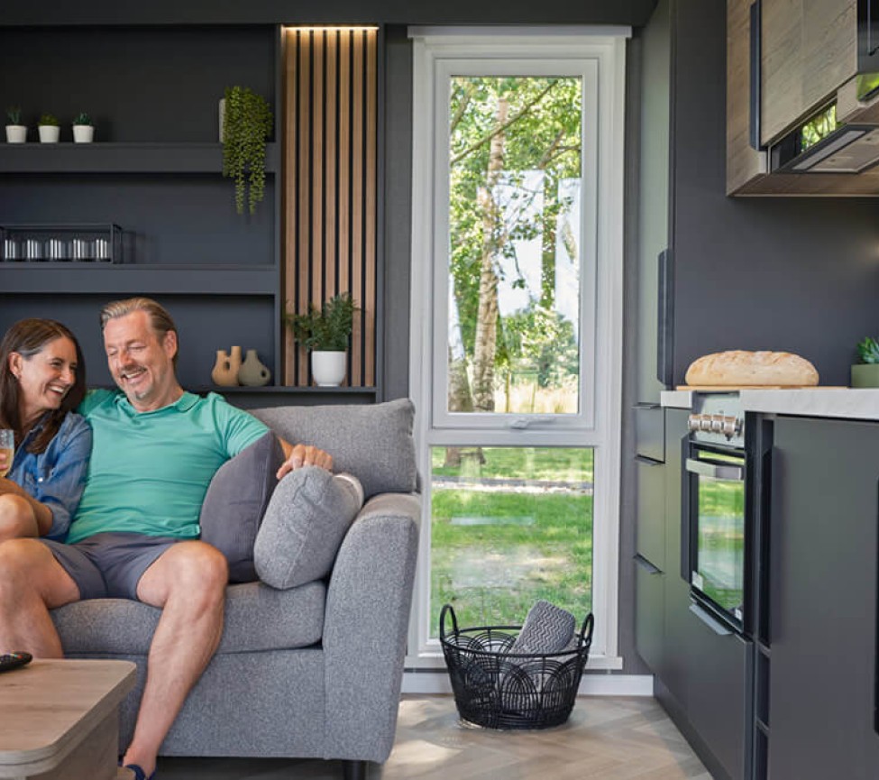 2026 Swift S-Pod 4 Couple Relaxing in Living Room