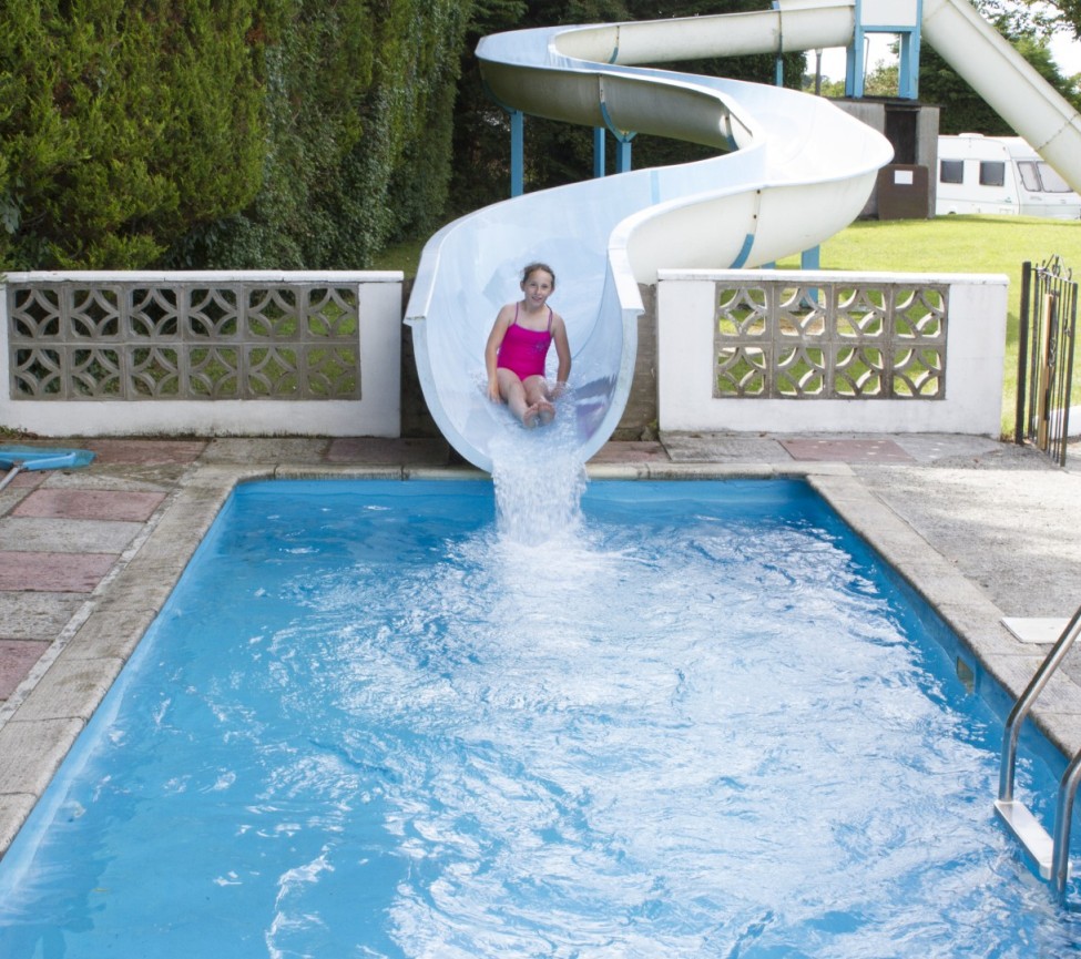 outdoor pool with slide at Little Bodieve Holiday Park