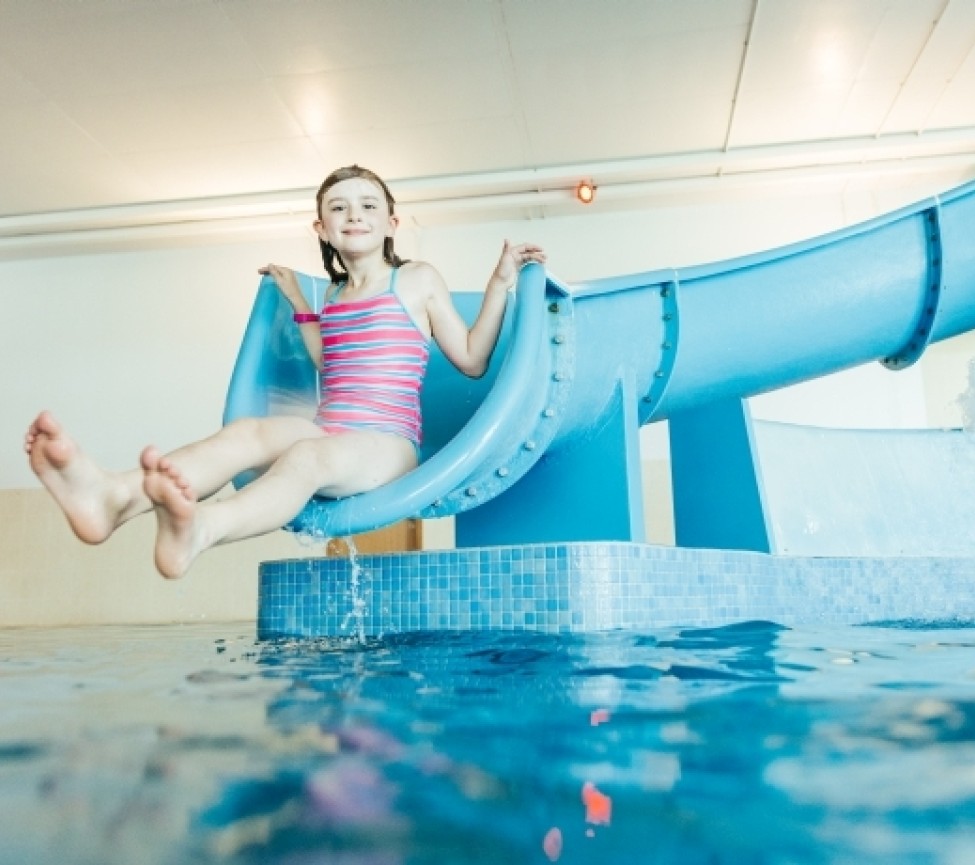 down the slides at the indoor pool at Pentewan Sands Holiday Park