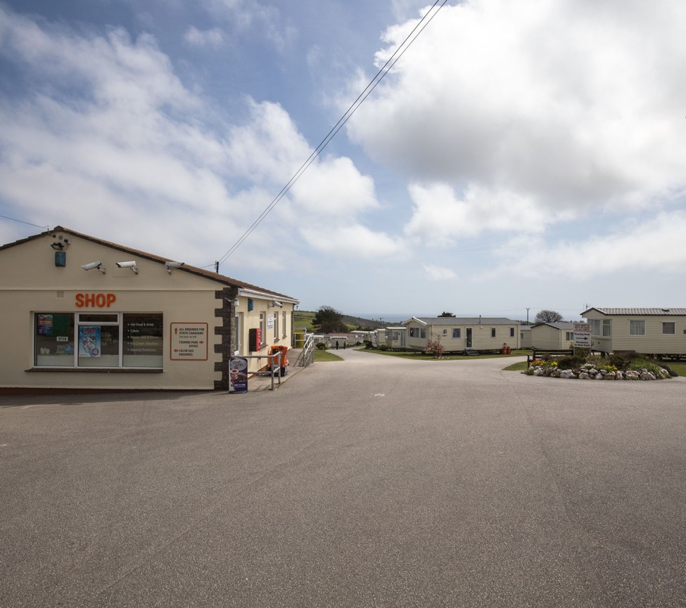 reception and caravans ar=t West Wayland Caravan Park