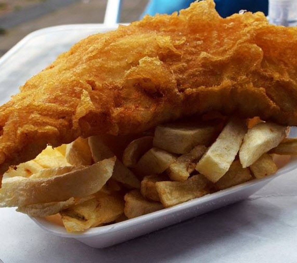 enjoynign fish and chips on holiday