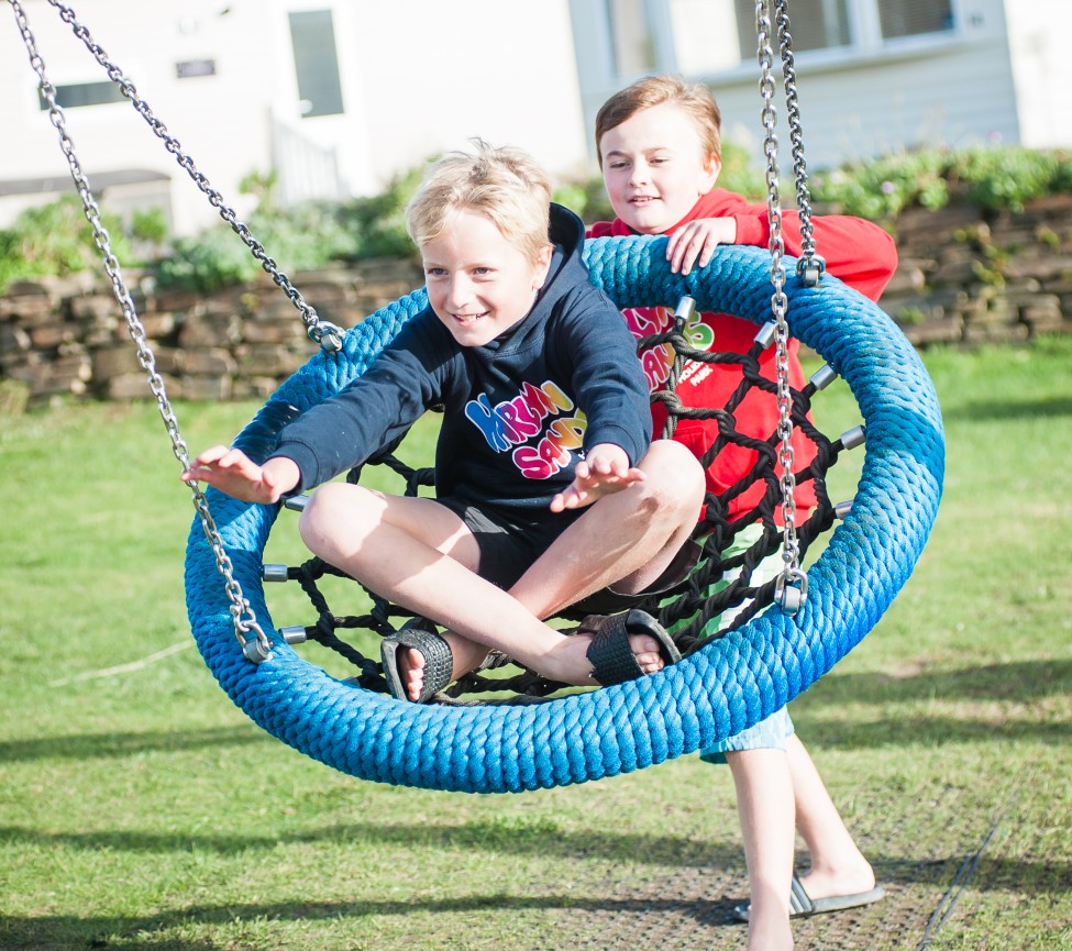 on the swing at Harlyn Sands Holiday Park