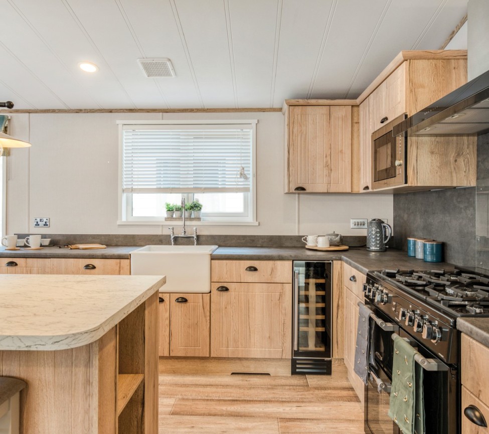 2024 Atlas Debonair Lodge fitted kitchen with belfast sink