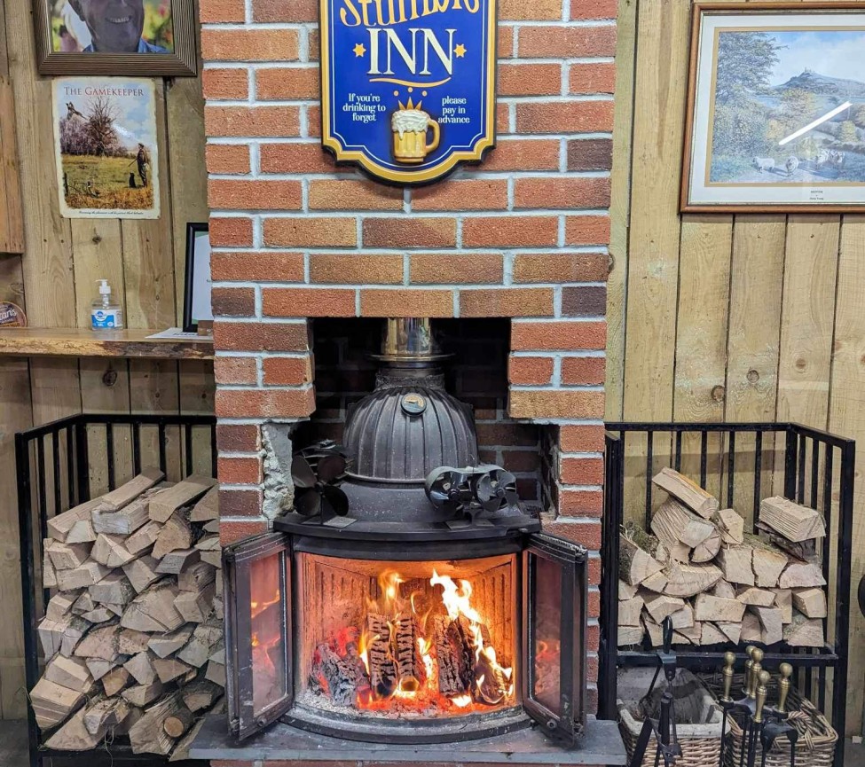 Chelsfield Farm Holiday Park Fire place at The Stumble INN