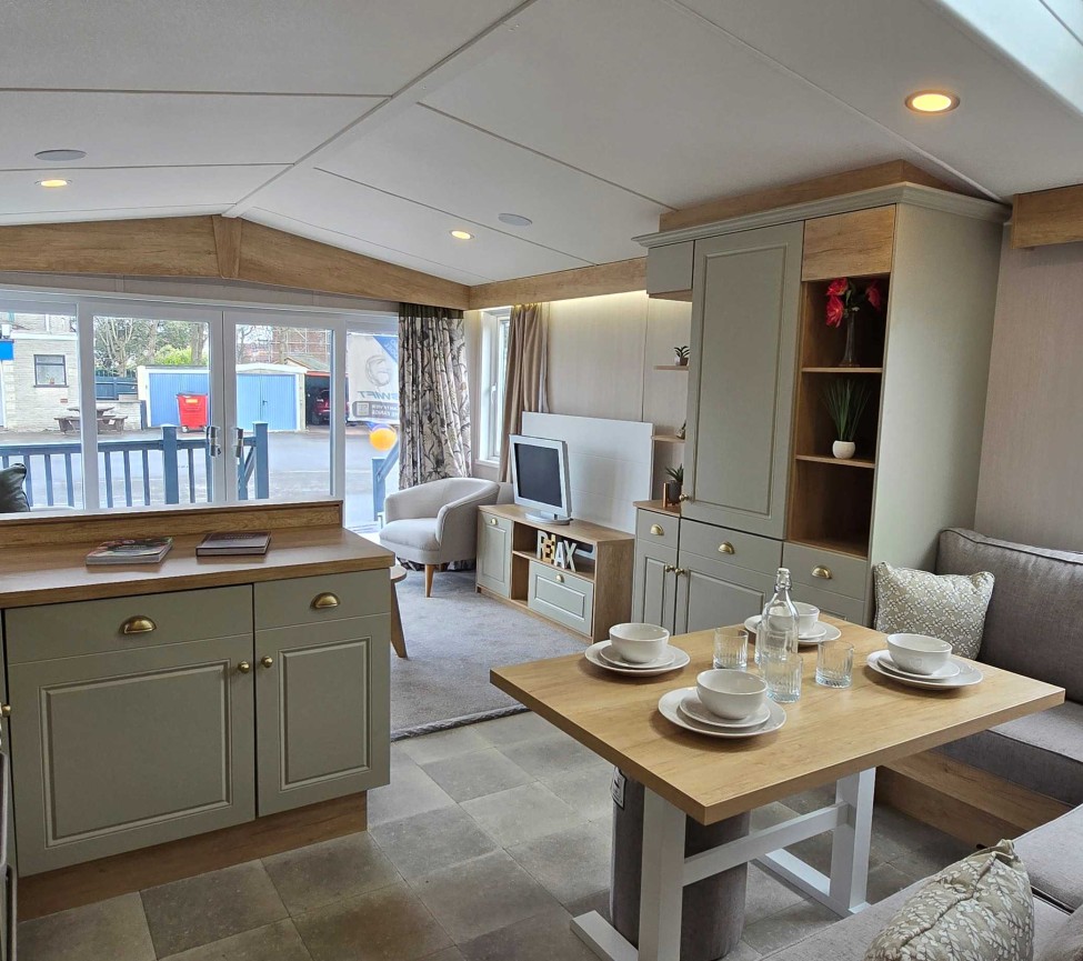 Interior Kitchen and Dining view of the 2023 Swift Moselle Lodge