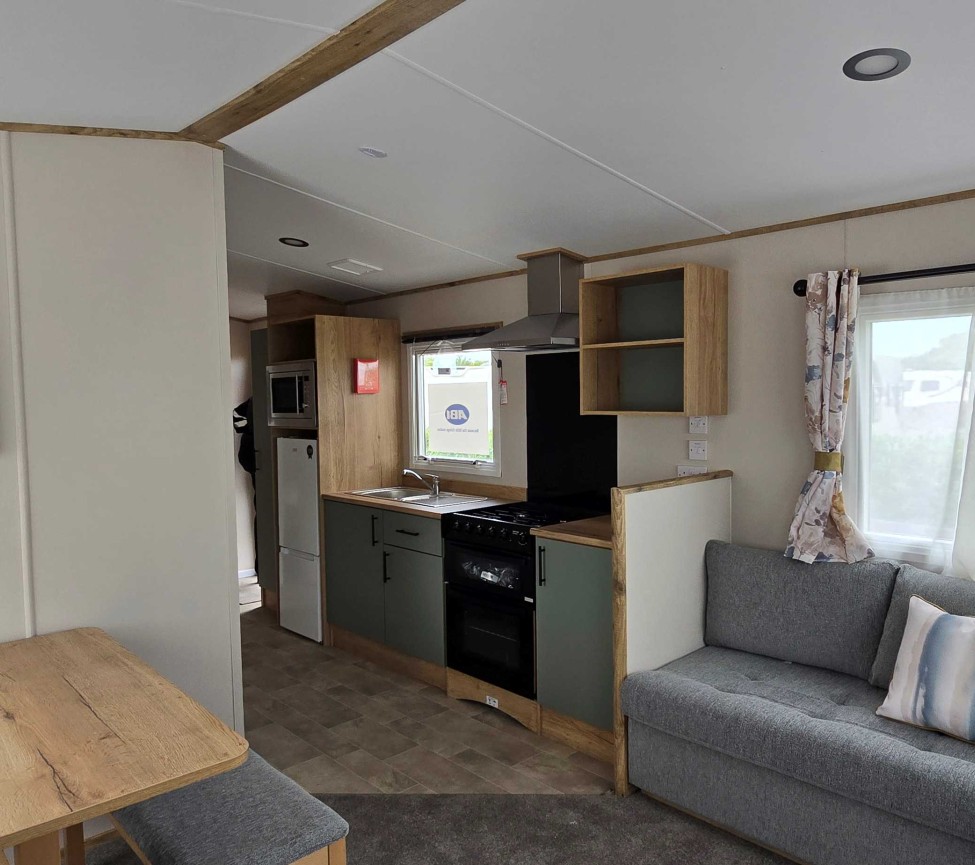 Dining, Lounge and Kitchen view of the 2025 ABI Coworth Deluxe 28 x 12 for Sale at Westbrook Farm Caravan Park