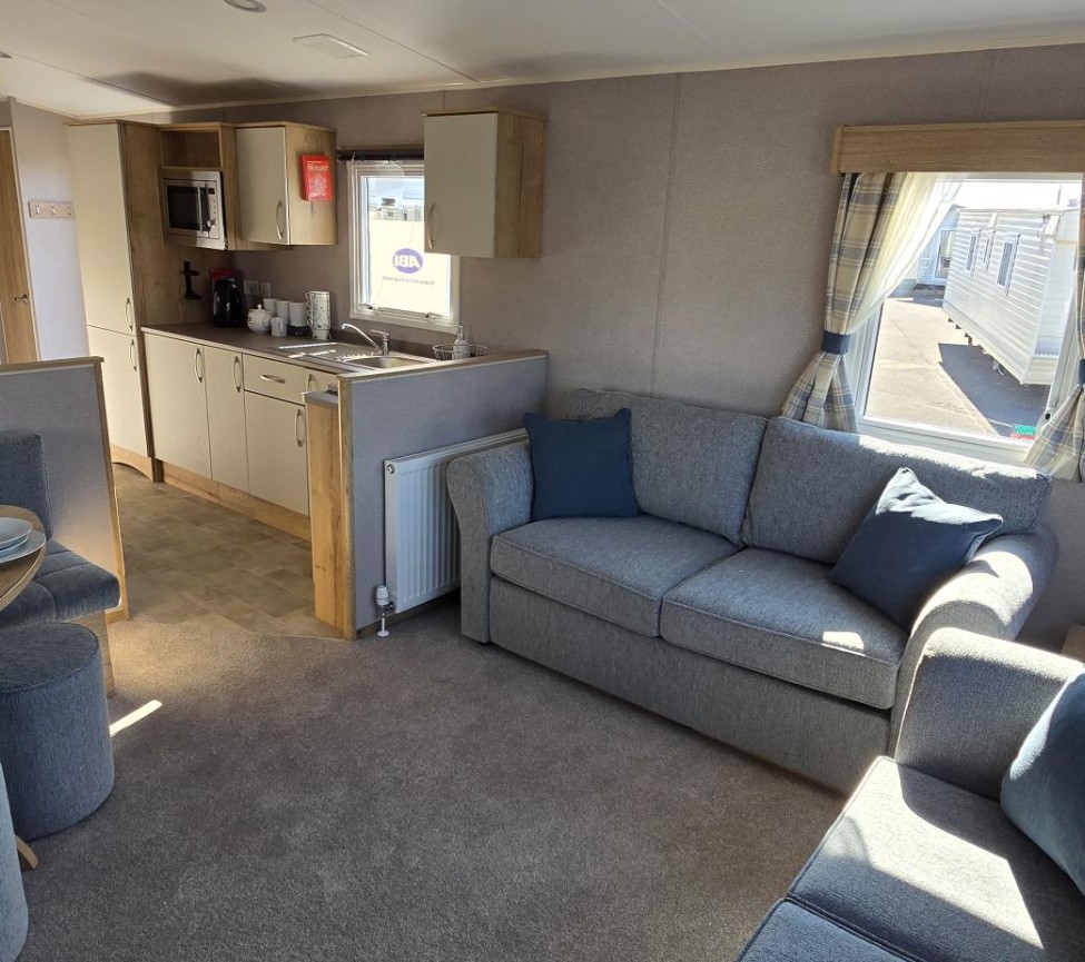 Interior Lounge, Dining Area and Kitchen view of the 2025 ABI Summer Breeze Deluxe