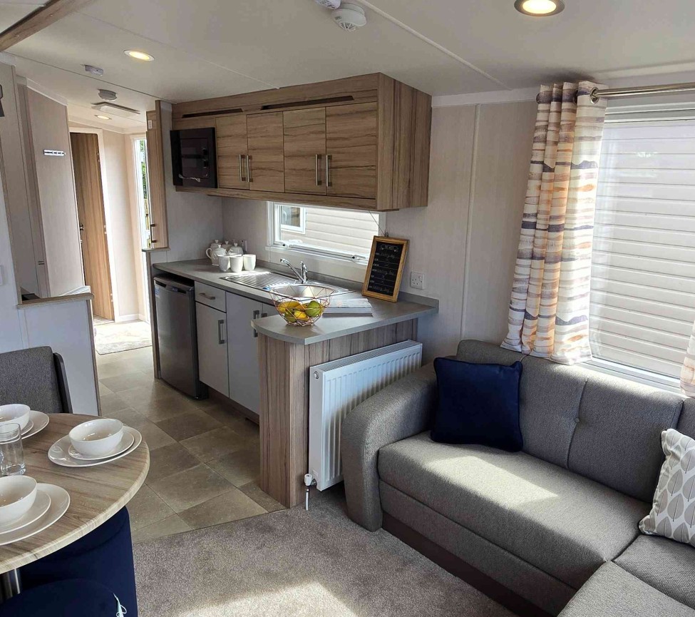 Interior Lounge, Dining and Kitchen view of the 2025 Swift Atlantique 28 x 10