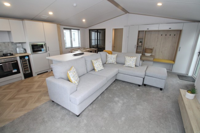 Interior Lounge and Kitchen view of the 2023 Atlas Oakwood Lodge 40 x 20 x 2 Bedroom